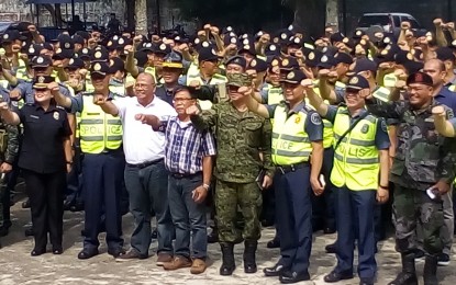 <p><strong>POLL DEPLOYMENT.</strong> Negros Occidental Provincial Elections Supervisor Jessie Suarez (3<sup>rd</sup> from left) and Senior Superintendent Rodolfo Castil (2<sup>nd</sup> from left), police provincial director, with officials from other law enforcement agencies and troops to be deployed for the May 14 barangay and SK elections during the send-off ceremony on Friday (May 11, 2018) <em>(Photo by Nanette L. Guadalquiver)</em></p>